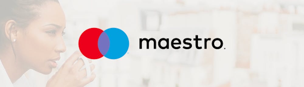 Maestro Logo vor Frau mit Tasse im Hintergrund